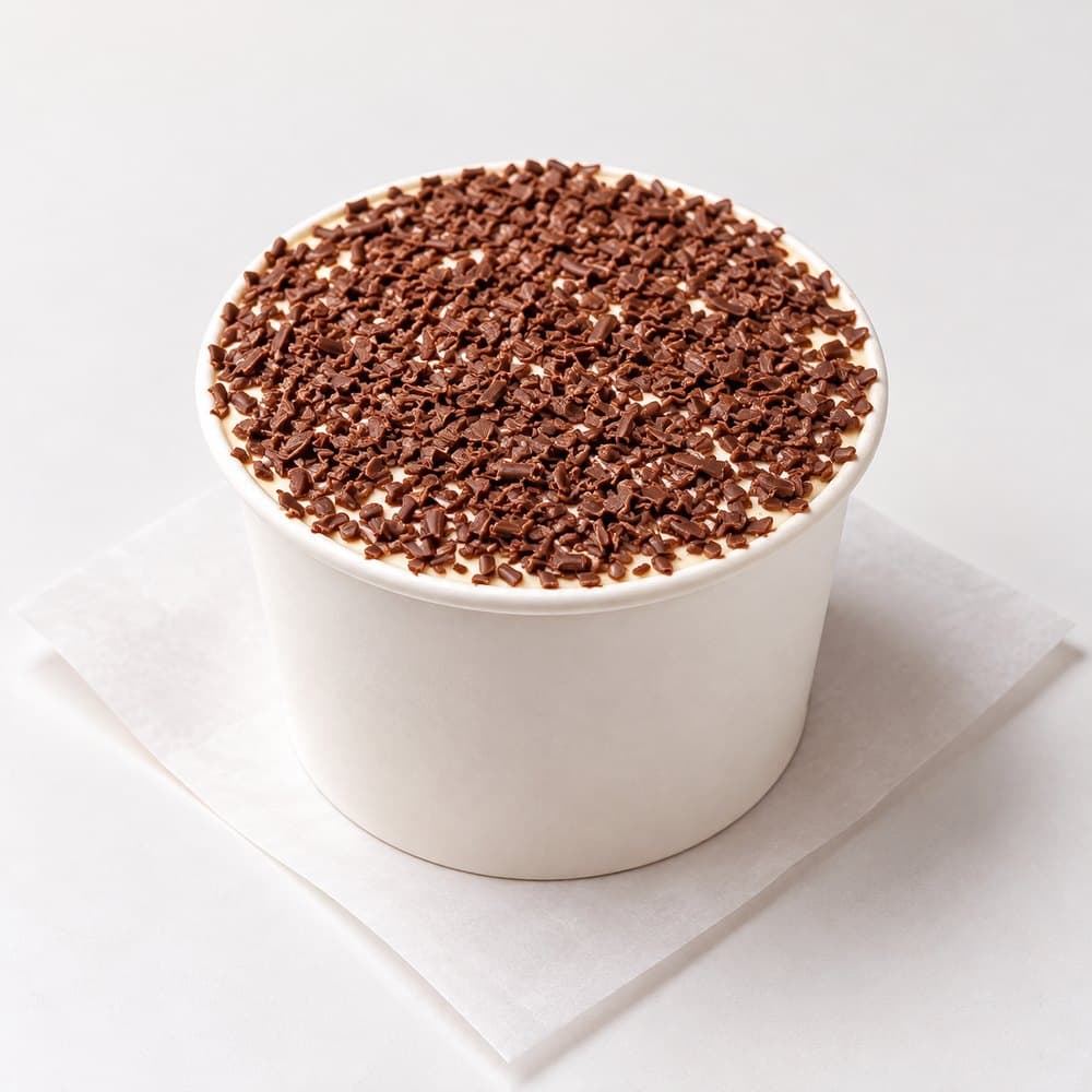 Coffee tiramisu cup topped with chocolate flakes, from bōm dough in Cambridge, MA.
