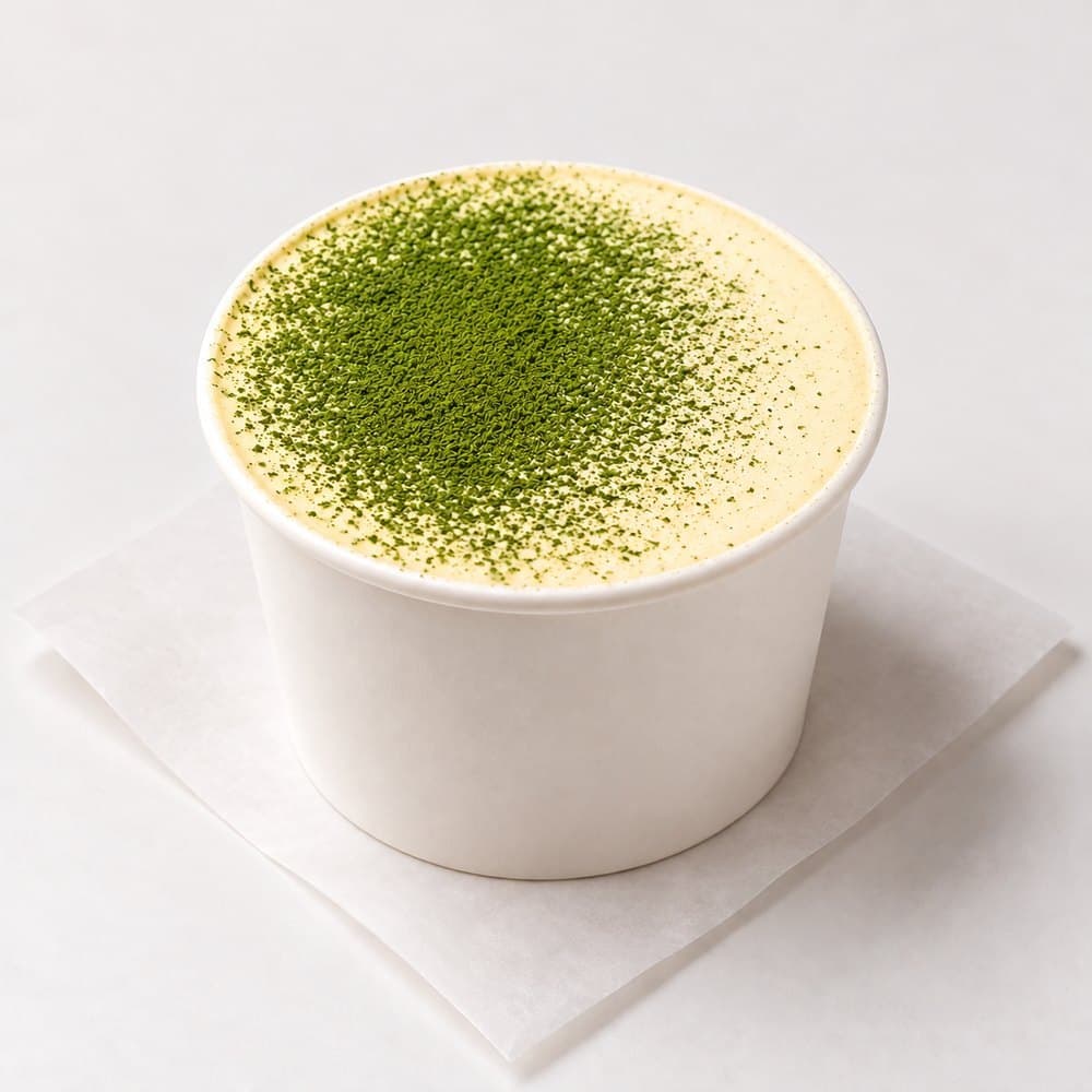 Matcha tiramisu cup dusted with ceremonial matcha, from bōm dough in Cambridge, MA.