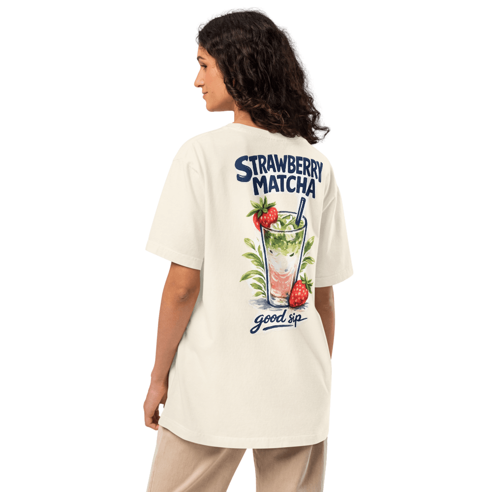 Woman wearing the bōm dough Strawberry Matcha Latte oversized café graphic tee in vintage white — The Drip.