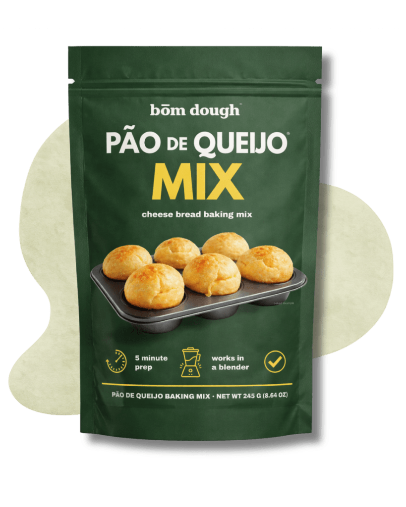 green bag of bôm dough pão de queijo cheese bread baking mix, a naturally gluten-free 3-step blender-ready mix.